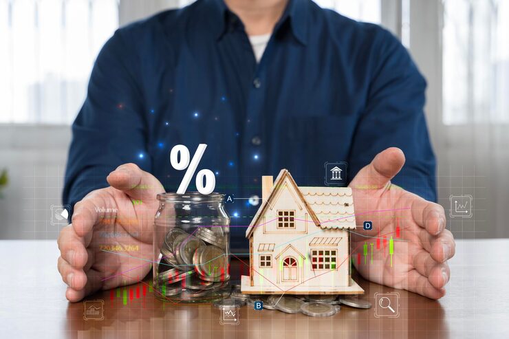 How interest rates affect mortgage payments - percent symbol, coin jar, and house model with financial charts