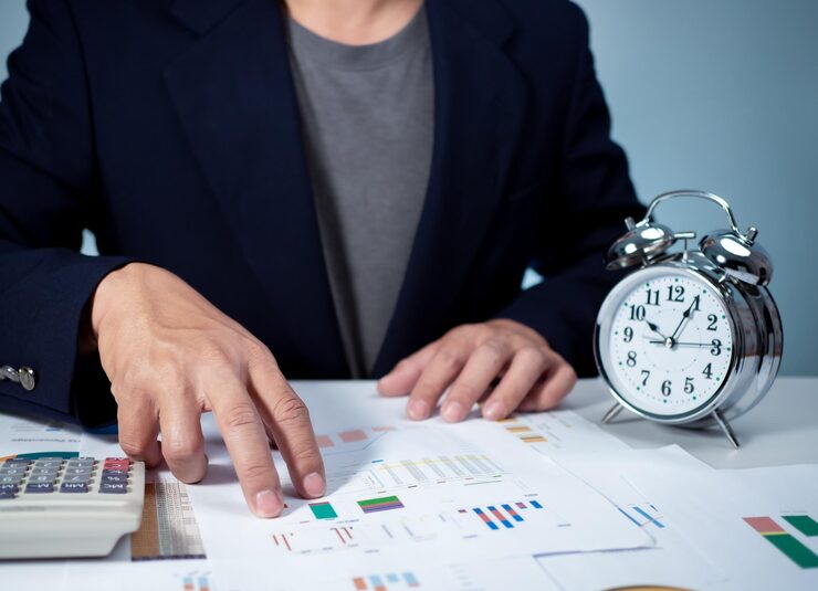 calculate work hours with a calculator, alarm clock, and financial charts