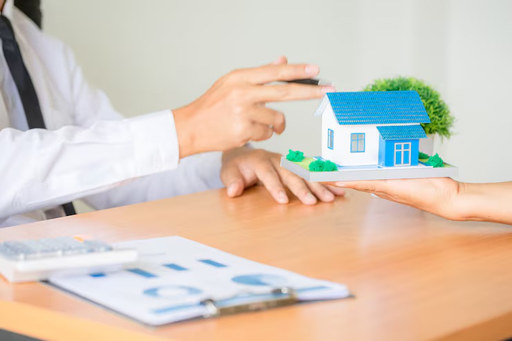 home equity loan vs HELOC comparison guide showing house model handoff