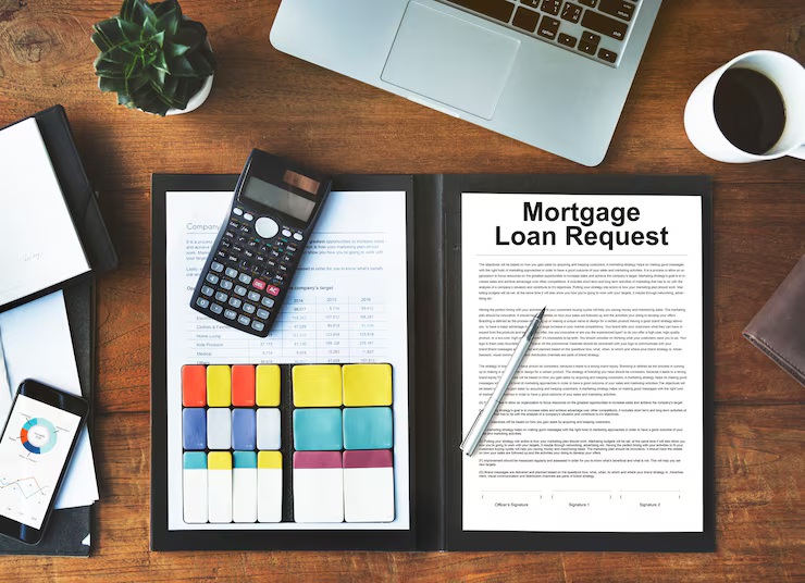 Loan to value ratio calculation for a mortgage loan request with calculator and financial documents
